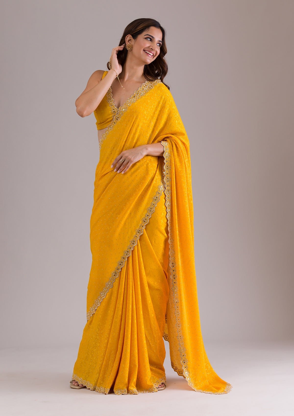 Bravix Elegant Mustard Semi Crepe Saree with Exquisite Stonework
