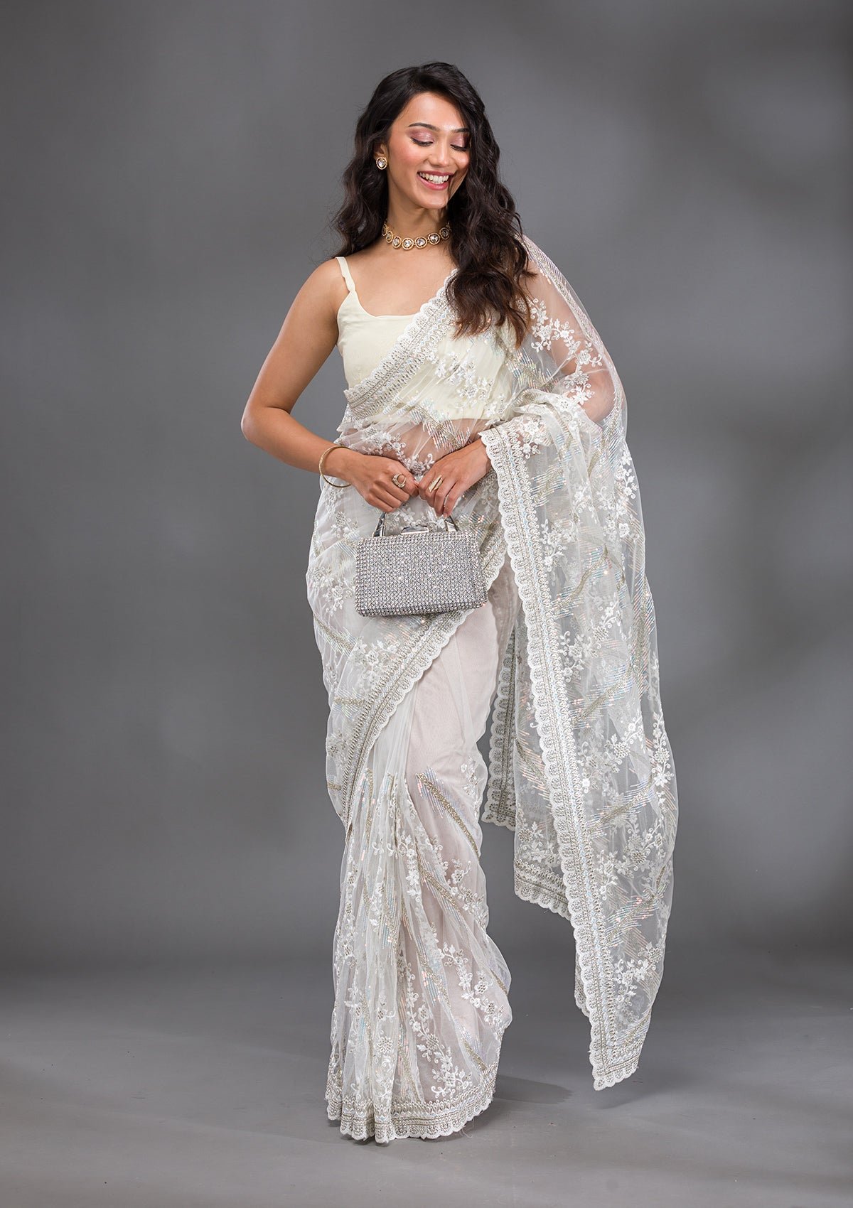 Bravix Stunning Off White Sequined Net Saree for Glamorous Occasions