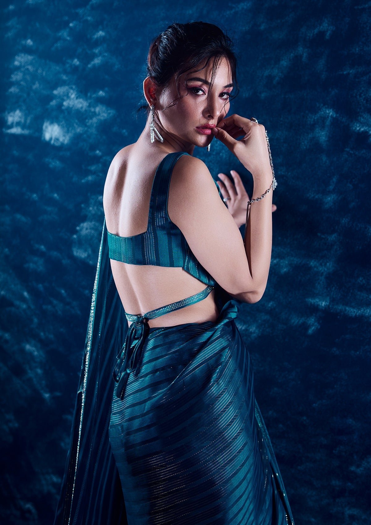 Elegantly Crafted Peacock Blue Swarovski Georgette Designer Saree - Image 3