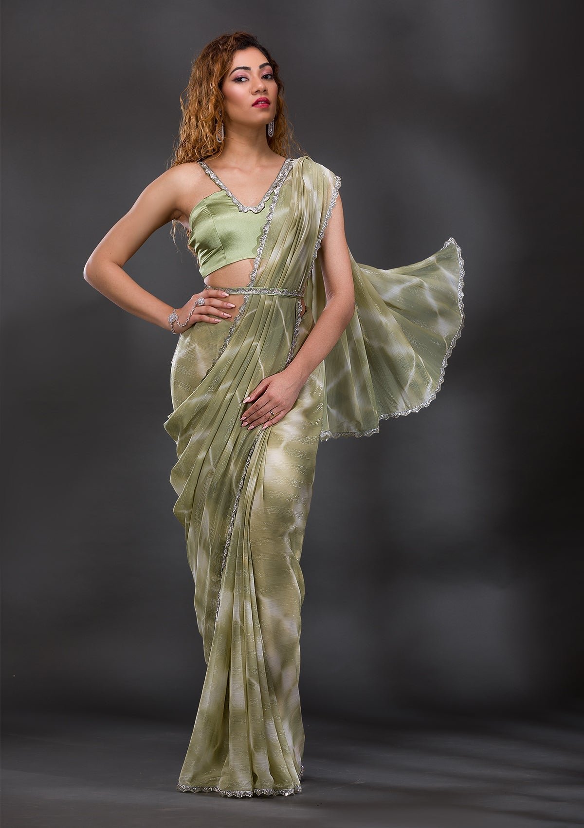 Bravix Enchanting Pista Green Georgette Saree with Elegant Stonework and Shimmer