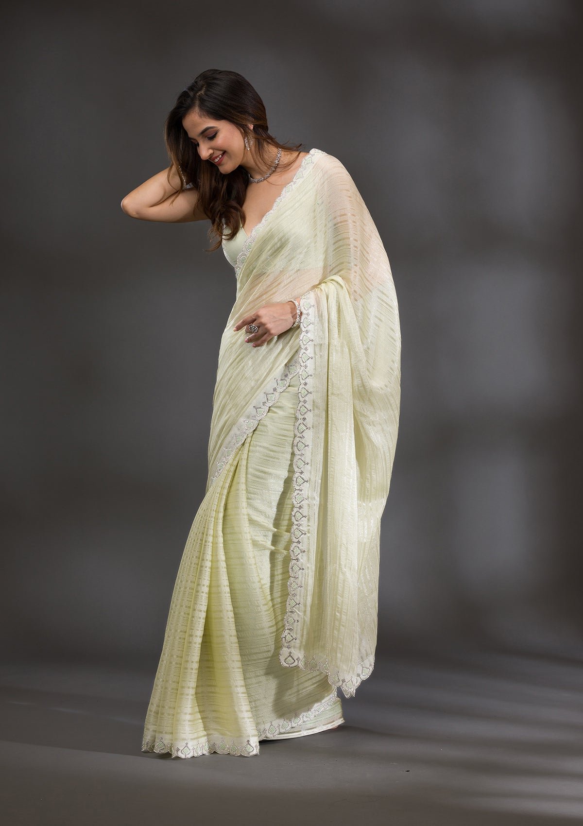 Bravix Elegant Pista Green Georgette Saree with Stunning Swarovski Accents - Image 3