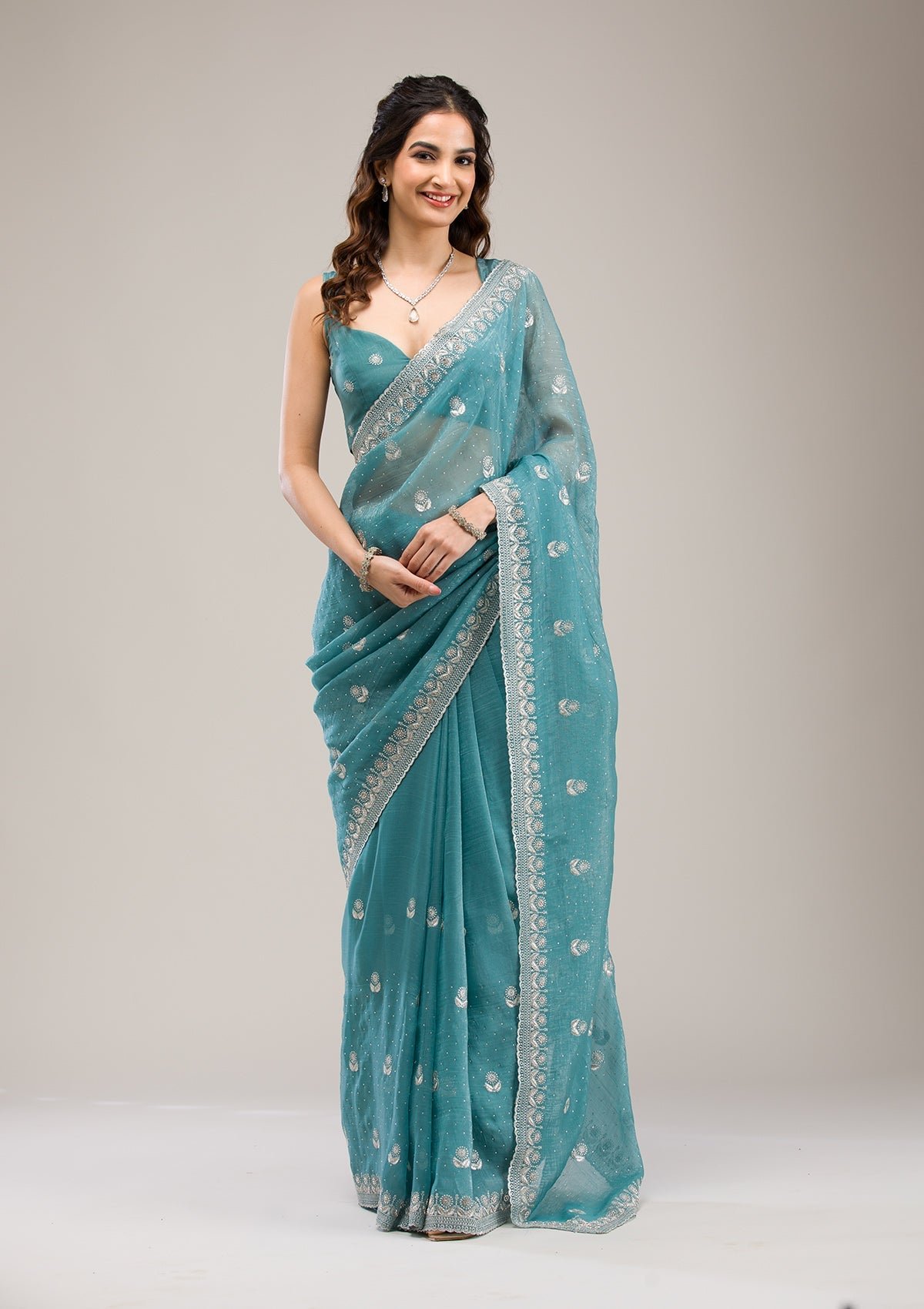 Bravix Elegant Sea Green Tissue Saree with Exquisite Zariwork